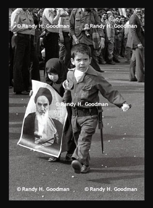boy and girl with Khomeini poster